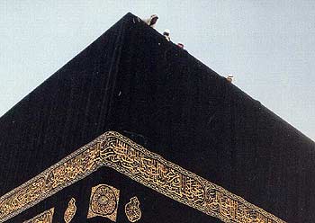 Men on the roof of the Holy Ka'bah